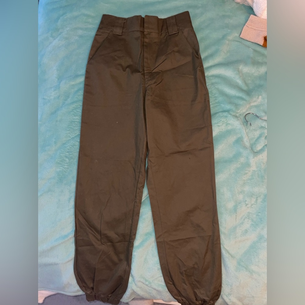 Brown toned cargo dress like pants. Singed bottoms. Nice quality